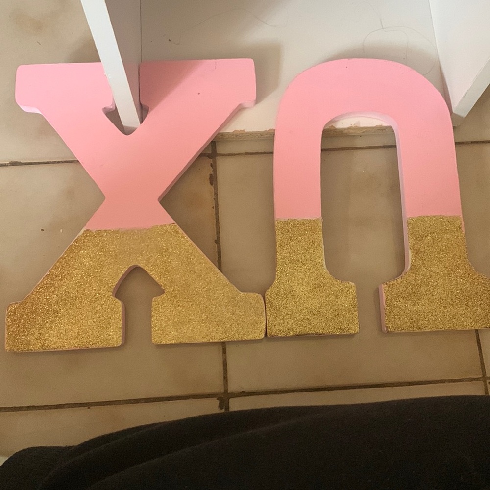 Pink and gold Chi Omega letters